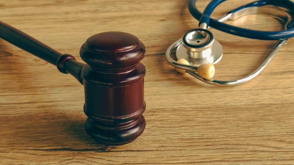 Judge gavel resting beside stethoscope symbolizing medical malpractice law